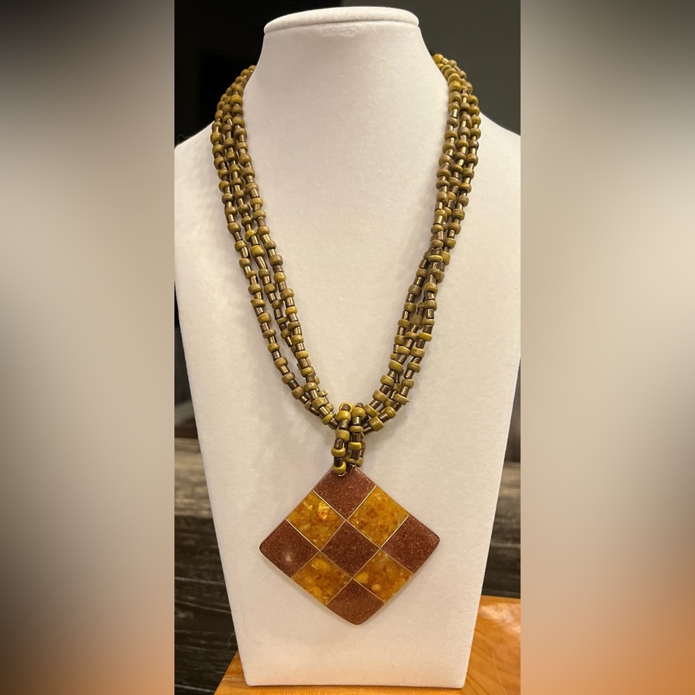 Elegant Multi-Strand Necklace with Amber-Toned Pendant